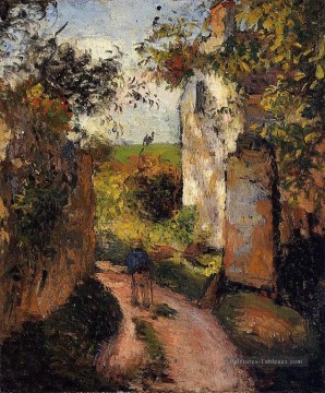 un paysan dans la ruelle de l’ermitage de Pontoise 1876 Camille Pissarro Peinture à l'huile